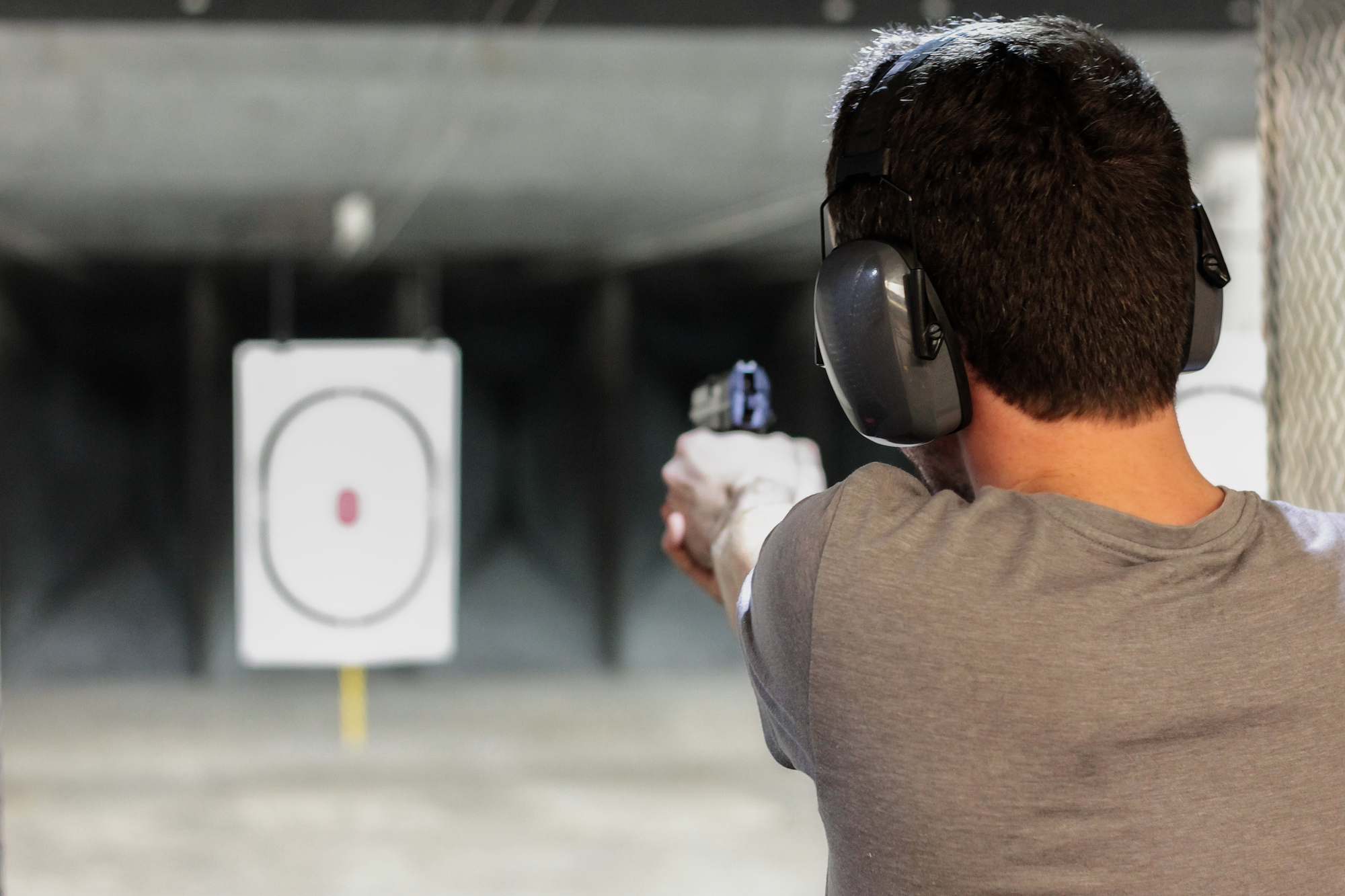 Man Practice Shooting In The Indoor Shooting Range